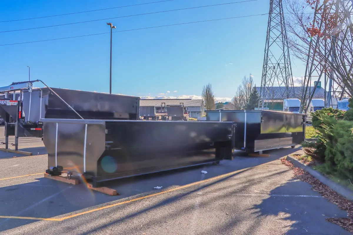 Roll-off dumpster ready for waste disposal at job site for 3 Yard Dumpster Rental in Arlington
